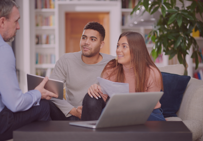 Young couple reviewing mortgage options while managing student loan debt
