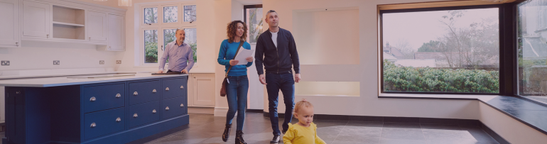 Image of parents and child having a viewing hosted by estate agent